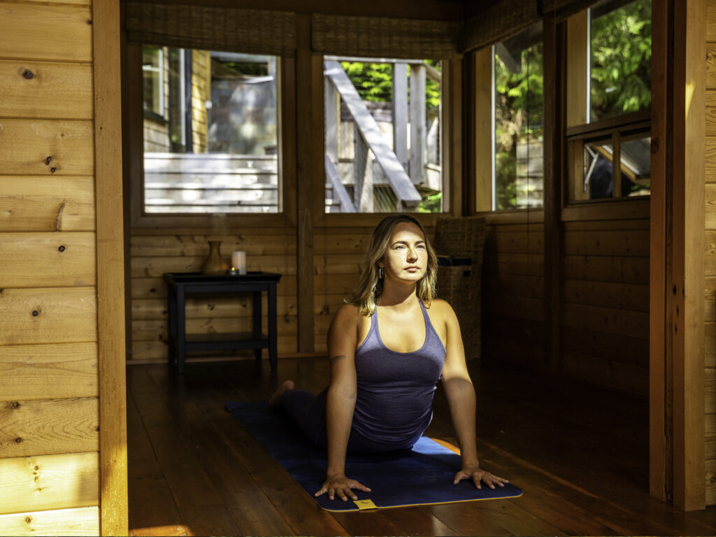 Yoga practice in a sunlit wooden studio